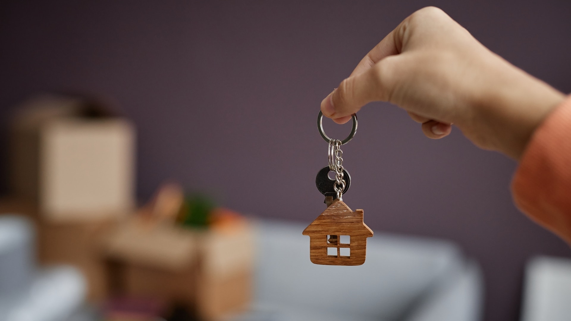 woman-getting-keys-from-new-apartment-2025-03-06-01-04-29-utc